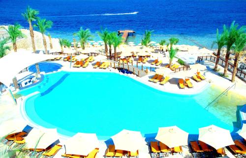 an overhead view of a swimming pool at a resort at Xperience Sea Breeze Resort in Sharm El Sheikh