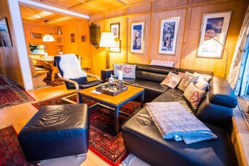 a living room with a couch and a table at Haus Barrett by MoniCare in Seefeld in Tirol