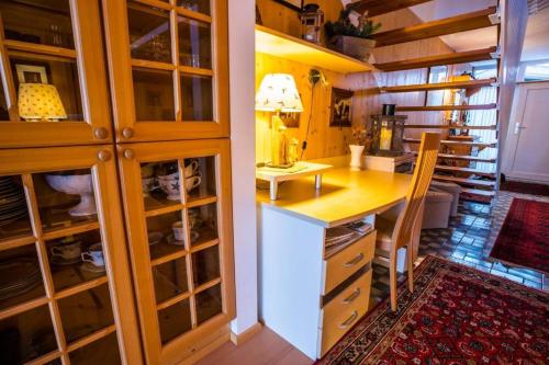 a kitchen with a counter and a desk in a room at Haus Barrett by MoniCare in Seefeld in Tirol