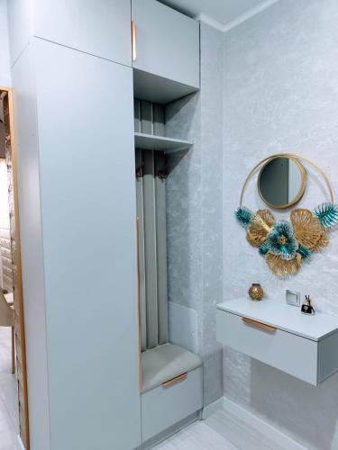 a bathroom with a mirror and a white sink at Taraz 2 in Taraz