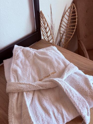 a white towel sitting on top of a table at Dream house Villa in Alyki