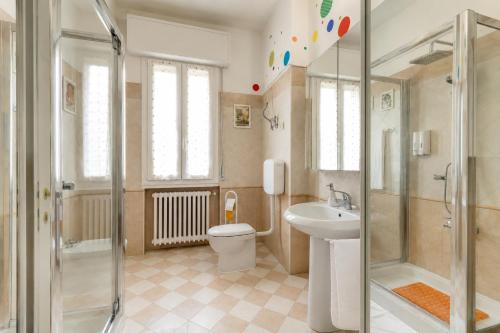 a bathroom with a toilet and a sink and a shower at San Felice Central Room in Bologna
