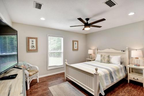 a bedroom with a bed and a ceiling fan at 106 Shore Rush Trail in Blackbanks