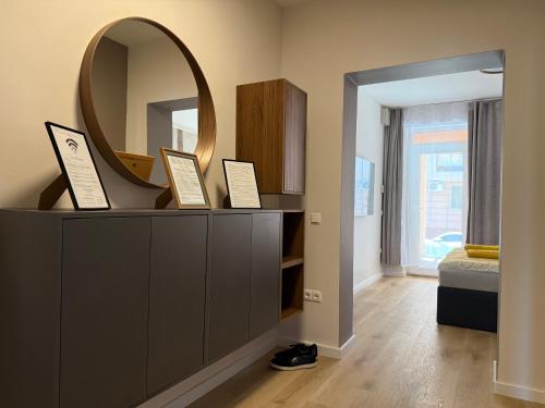 a mirror on top of a dresser in a room at Heaven SPA Eger in Eger