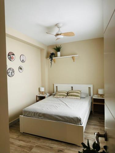 a bedroom with a bed and a ceiling fan at Casa Roa in Altea