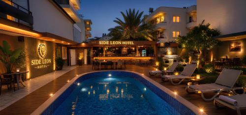 a swimming pool in the middle of a building at Green Side Leon Hotel in Side