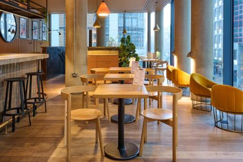 a row of tables and chairs in a restaurant at Leman Locke in London