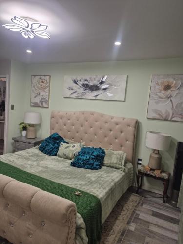 a bedroom with a large bed and a couch at La casa de la Playa in Primo Tapia