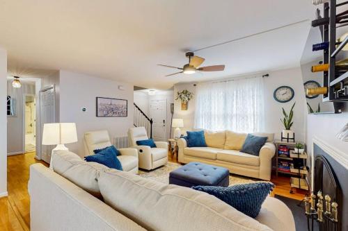 a living room with couches and a fireplace at 838 Ocean Parkway in Ocean Pines