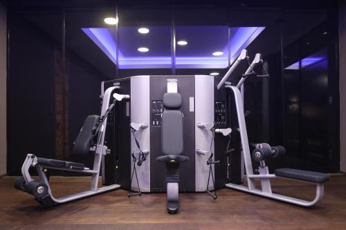 a gym with two tread machines in a room at SEVERIN*S – The Alpine Retreat in Lech am Arlberg