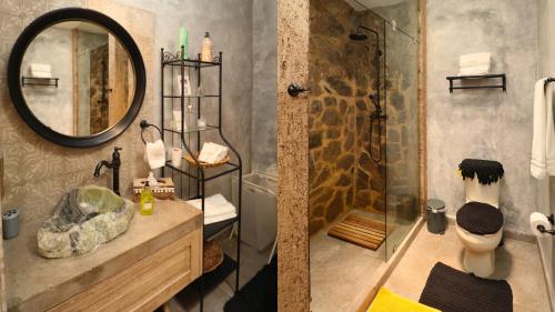 a bathroom with a shower and a sink and a mirror at Loft Giofiel in Santeagueda