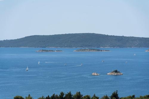 a large body of water with boats in it at Apartments Vini in Donji Seget