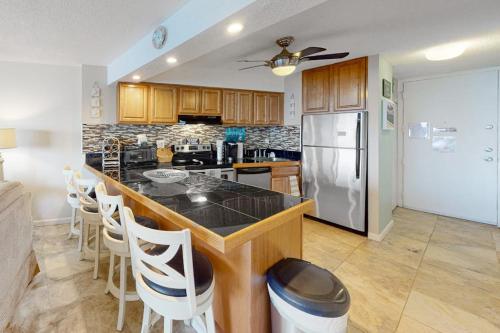 a kitchen with a counter and a refrigerator at Antigua 1004 in Ocean City