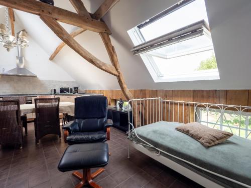 a bedroom with a bed and a dining room at Anc. Seigneurie de Boucaut in Leuze-en-Hainaut