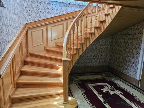a staircase in a house with a carpet at Qecresh Garden House in Qǝçrǝş