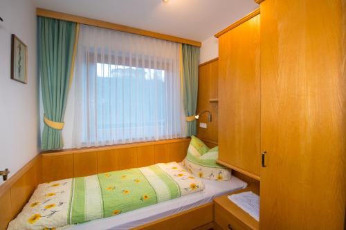 Ein Bett oder Betten in einem Zimmer der Unterkunft Appartement Hochleitner