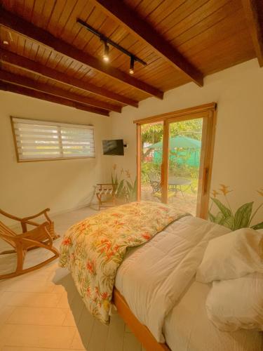 a bedroom with a bed in a room with a window at Casa Úrsula in Panama City