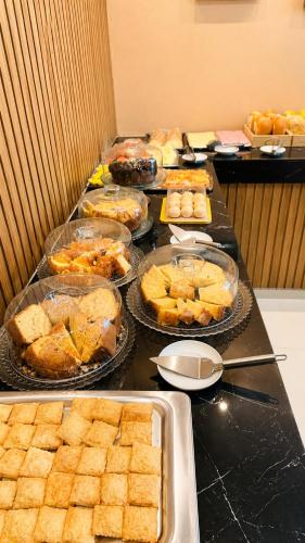 a buffet line with many different types of food at River Suites Hotel Barreirinhas in Barreirinhas