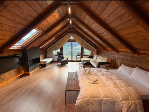 a bedroom with a large bed in a room at 4 MOUNTAIN HILLS in Megalo Chorio