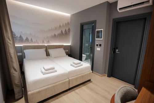 En eller flere senge i et værelse på Select Boutique Hotel