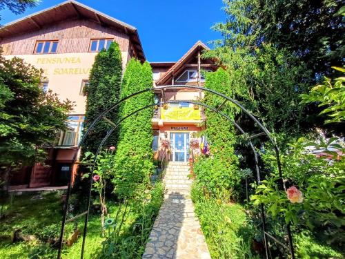 a house in the middle of a garden at Pensiunea Agroturistică Piscul Soarelui in Capu Piscului
