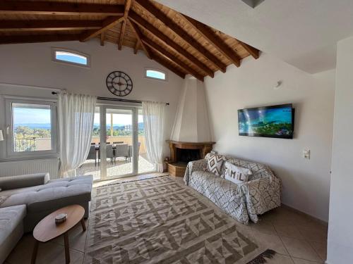 a living room with a couch and a table at Villa in Skiathos in Skiathos