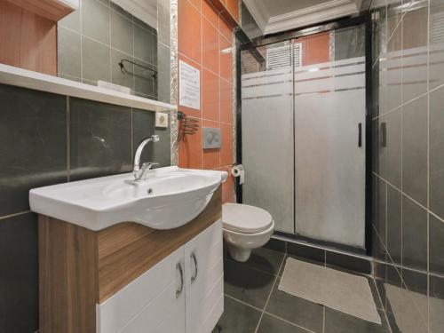 a bathroom with a sink and a toilet at YOLO Hostel in Istanbul
