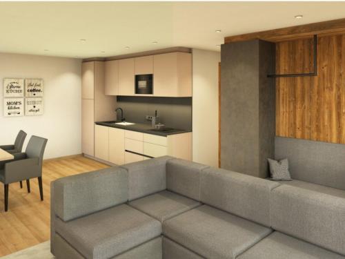 a living room with a couch and a kitchen at App. Sun Burdengeja in Selva di Val Gardena