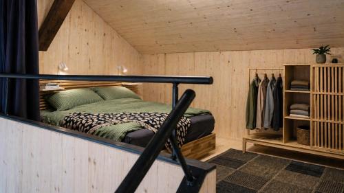 a room with a bed in a wooden cabin at Union Lodge Fabrik in Bern
