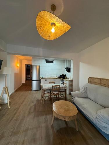 a living room with a couch and a table at Las eras 84 in Níjar