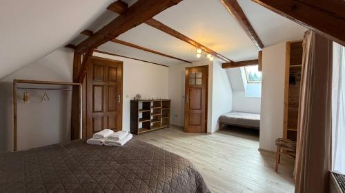 a bedroom with a bed in a room at Agroturystyka Folwark Natura in Wleń