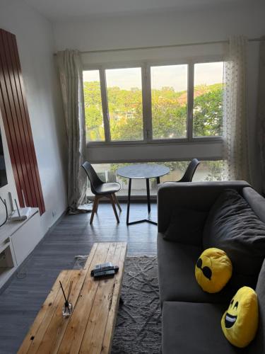 a living room with a couch and a table at Harmonie in Abidjan