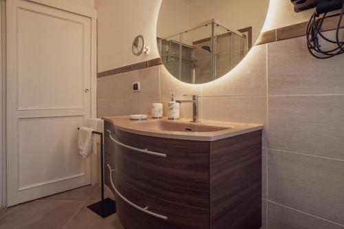 a bathroom with a sink and a mirror at Villa IV - PRIVATE LIVING in Alghero