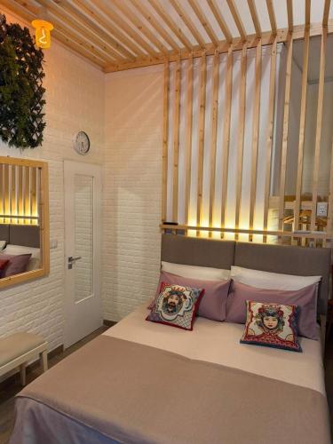 a bedroom with a bed with two pillows on it at Attardo's House in Catania