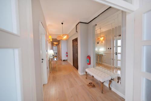 a hallway with a bench in the middle of a room at Zumra's White Houses in Trabzon