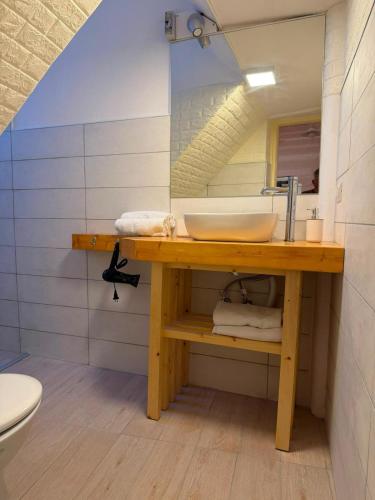 a bathroom with a sink and a mirror at Attardo's House in Catania