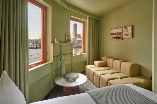 a hotel room with a bed and a window at Locke at Broken Wharf in London
