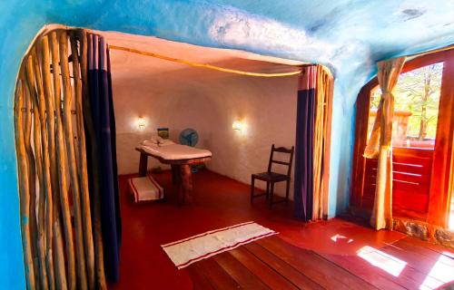 a room with a sink and a table in a room at Suarez Hotel in Antsiranana