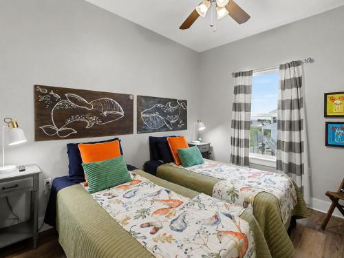 a bedroom with two beds and a window at 3BD Beach House by Next Step Property Management in Long Beach