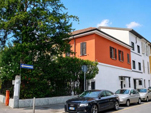 a black car parked in front of a building at Rainbow District Mood Villa in Milan