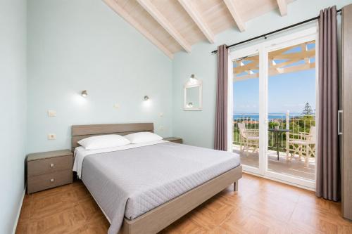 a bedroom with a bed and a view of the ocean at Villa Magda Dione in Gaios