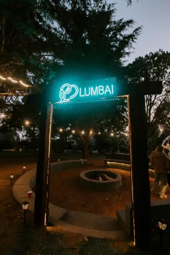 a green street sign that reads duneland at night at Lumbai Glamping Mazamitla in Mazamitla