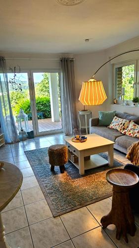 a living room with a couch and a table at Eifelglück in Heimbach