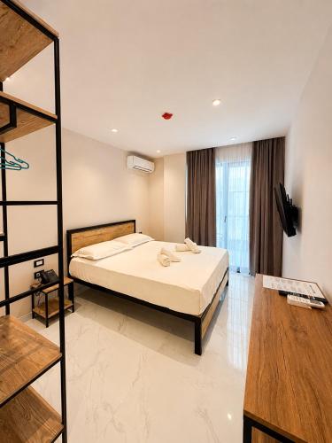 a bedroom with a bed in a room at Blester Hotel Golem Durres in Golem