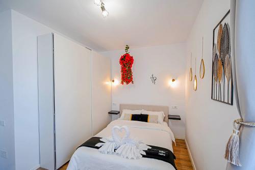 a bedroom with two beds and a red christmas decoration at ChicStudio Full Kitchen AC Free Parking Popcorn in Chiajna