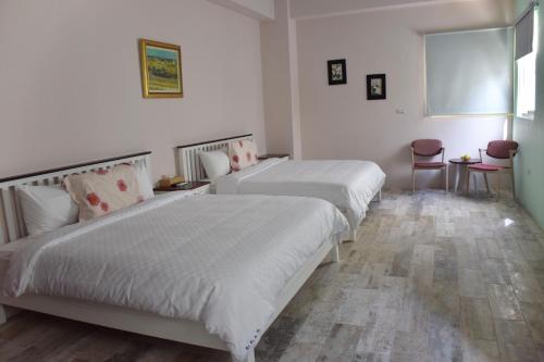 Ένα ή περισσότερα κρεβάτια σε δωμάτιο στο Red Roof B&B