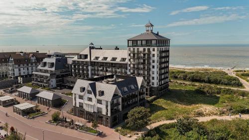 an aerial view of a building next to the beach at The Strand Agency - June in Cadzand-Bad