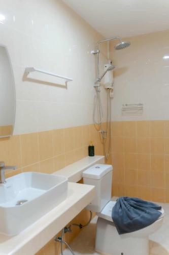 a bathroom with a sink and a toilet and a shower at PGD Blue city view in Rawai Beach