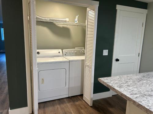 a kitchen with a washer and dryer in a room at Thirty-Six Street Retreat in Missoula