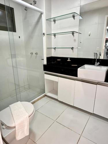 a bathroom with a shower and a toilet and a sink at WaiWai Residence Cumbuco in Caucaia